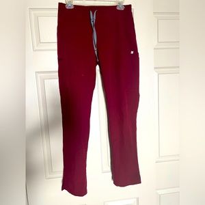 Figs Burgundy Yola Skinny scrub pants.